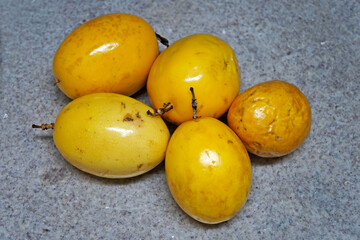 Passion fruits on granite background 