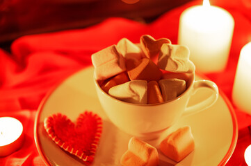 Winter Christmas or Valentine's day holidays background with candles, christmas light