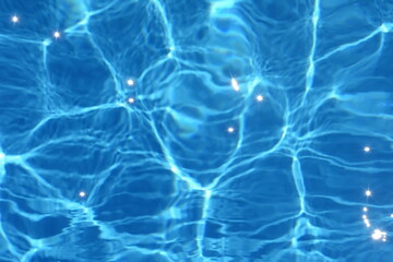 Fototapeta na wymiar Surface of blue swimming pool,background of water in swimming pool. Water background blue.