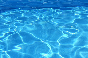 Surface of blue swimming pool,background of water in swimming pool. Water background blue.