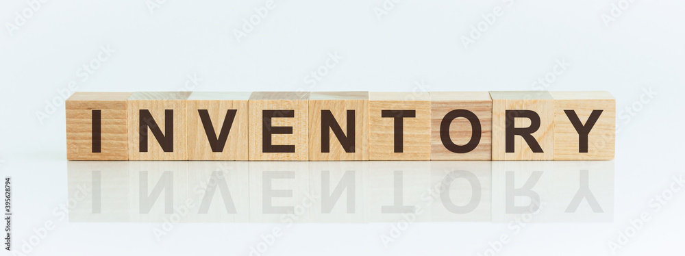 Poster Wooden Blocks with the text: INVENTORY. The text is written in black letters and is reflected in the mirror surface of the table.