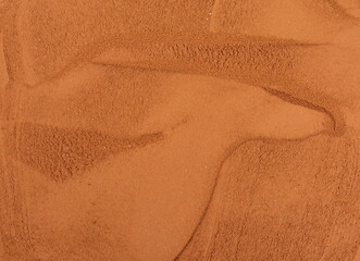 Pile of Red dirt (soil) on white. Heap of Red dry clay isolated on white background. Ochre, also spelled ocher, a natural yellow earth pigment.