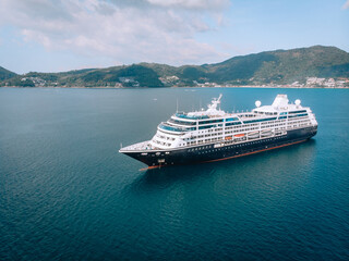 Obraz premium Large Cruise ship sailing across The Andaman sea - Aerial image. Beautiful sea landscape