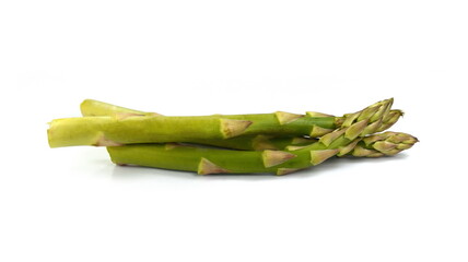 Asparagus isolated on white. Bunch of Raw Garden Asparagus with Shadow Isolated. Fresh Green Spring Vegetables on White Background. Edible Sprouts of Asparagus Officinalis  