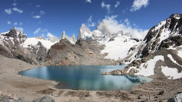 Timelapse of clouds that form around the mountain peak of Fitz Roy on a sunny day in Patagonia, Argentina