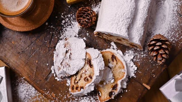  Traditional German sweet bread with dried fruits and marzipan for Christmas. Stollen on a wooden background. Above