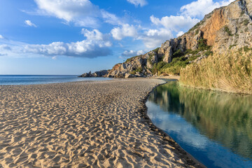 Preveli beach (aka., Palm Beach) at the mouth of the Megas river flowing through a gorgeous palm tree glade along the Kourtaliotiko gorge, Southern Crete, Greece
