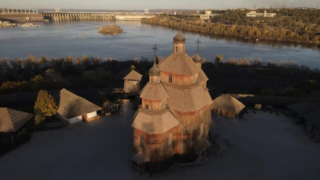 Khortytsya, Zaporozhye Sich drone, Dnipro Hydroelectric Power Plant, dam. 
Old church on the island of Khortitsa. Zaporozhye drone, Zaporizhia, Ukraine, over the dam.