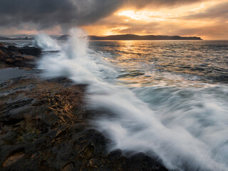 Overcast Sunrise on the rocks between Umina Beach and Pearl Beach on NSW Central Coast