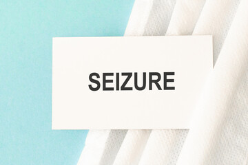 Word seizure with medical mask on a blue background. Preventive Medicine