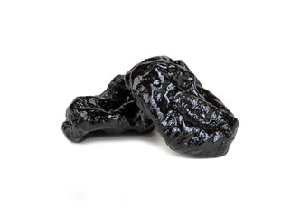 two prune berries isolated on white