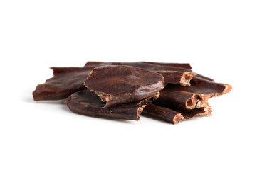 carob broken pod isolated on white close-up