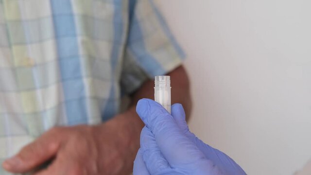 girl holds a kit for a dna test in a box, a cotton swab for scraping the epithelium, collecting genetic sample for analysis, concept of determining ethnic origin, paternity, genealogy, family tree