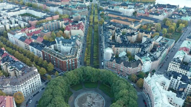 Aerial drone shot flying over the city of Stockholm. Karlplan plaza & fountain.