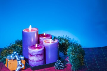 View of Christmas burning candles and decoration objects. Postcard. Christmas and New Year holidays concept background.
