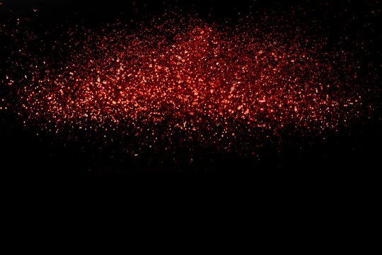 Closeup shot of beautiful red glitter for wallpaper or background