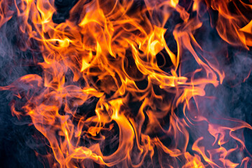 Fire flames. Flames and smoke on a dark background.