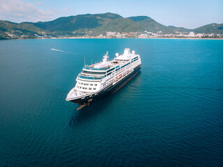 Obraz premium Large Cruise ship sailing across The Andaman sea - Aerial image. Beautiful sea landscape