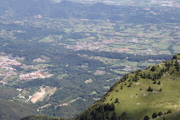Fototapeta premium view from the mountains to the lowlands and meadows and hills, the play of light