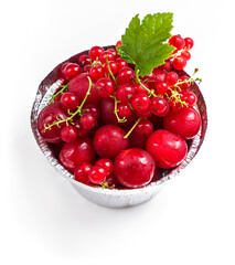 summer berries on a white background, red currant, cherry, raspberry