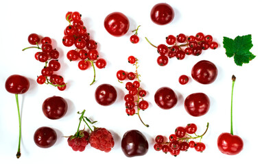 summer berries on a white background, red currant, cherry, raspberry