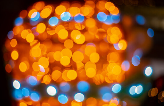 golden blue Christmas lights garland lamps illumination bokeh abstract concept picture