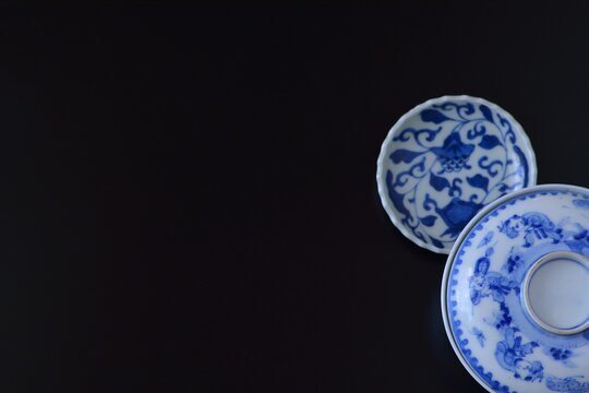 picture rice bowl. with picture small plate.This is a very fine example of Japanese traditional antique “ imari ware ”. black background soft focus image.