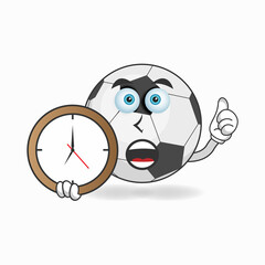 Fototapeta premium Soccer Ball mascot character holding a wall clock. vector illustration