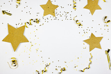Golden confetti and stars on white background. Party concept. Golden decorations, confetti, streamers, stars on white background.