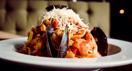 Pasta with sea shells prawns oysters and other sea creatures
