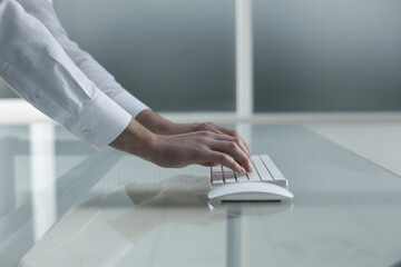 Man's hands are typing on the keyboard