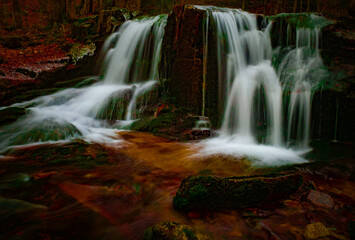 Wild brook with stones and waterfall in Jeseniky mountains, Eastern Europe, Moravia. Clean fresh cold watter, water stream. Long exposure image. .