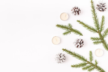 Fototapeta na wymiar Christmas, winter, new year composition. Fir tree branches, fir cone, candles on white background. Flat lay, top view, copy space