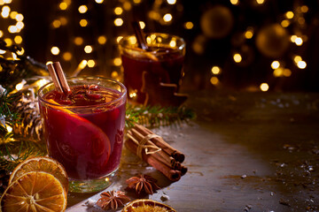 Glass of mulled wine on christmas decorations