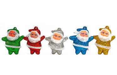 Multi-colored Santa Claus decorations on white background. copy space