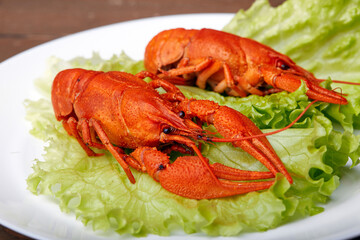 Close-up of boiled crayfish on a lettuce leaf