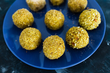plant-based food, homemade fried vegan pesto risotto balls arancini
