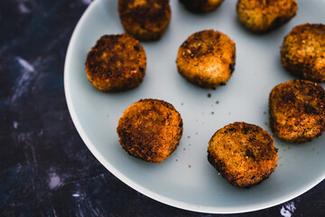 plant-based food, homemade fried vegan pesto risotto balls arancini