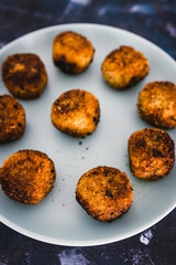 plant-based food, homemade fried vegan pesto risotto balls arancini