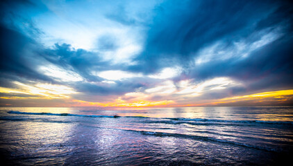 Beach at sunset with colorful sky, 