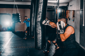 Fearles MMA Fighter practicing his punch on a punching bag
