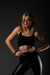 Sexy blonde in leather black pants going crazy.