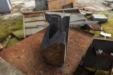 Piece of graphite from Chernobyl nuclear reactor in abandoned plant Jupiter near ghost town Pripyat
