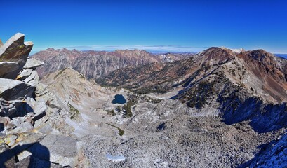 White Pine Lake views from trail mountain landscape towards Salt Lake Valley in Little Cottonwood Canyon, Wasatch Rocky mountain Range, Utah, United States. 