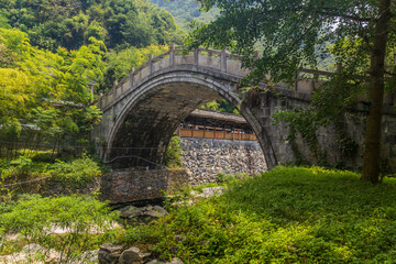 Fototapeta na wymiar Old stone bridge near Dehang Miao village, Hunan province, China