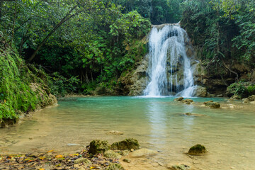 Small waterfall of El Limon cascade, Dominican Republic - obrazy, fototapety, plakaty