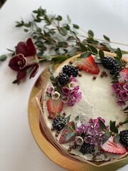 Decorative christmas cake with flowers above, top view