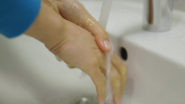 Close-up of hand washing during Corona - videoclip