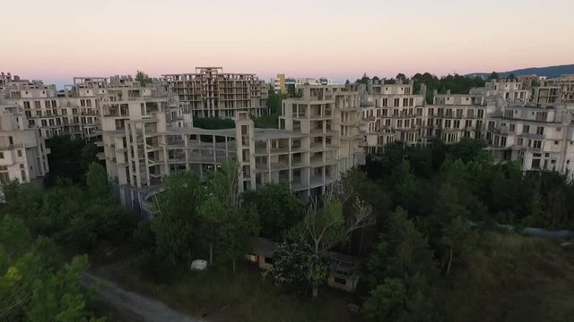 Aerial view of the abandoned hotel Costa del Croco, located in Tsarevo, Bulgaria. Flying during sunset near the seacoast.
