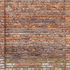 Weathered stained old brick wall texture for background